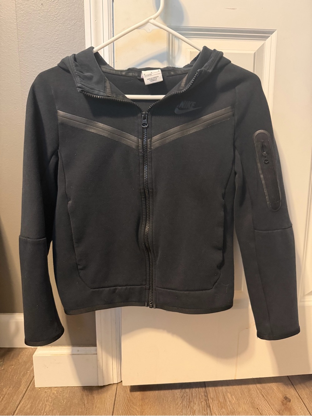 Nike Tech Fleece Full-Zip Hoodie featuring a signature zippered pocket